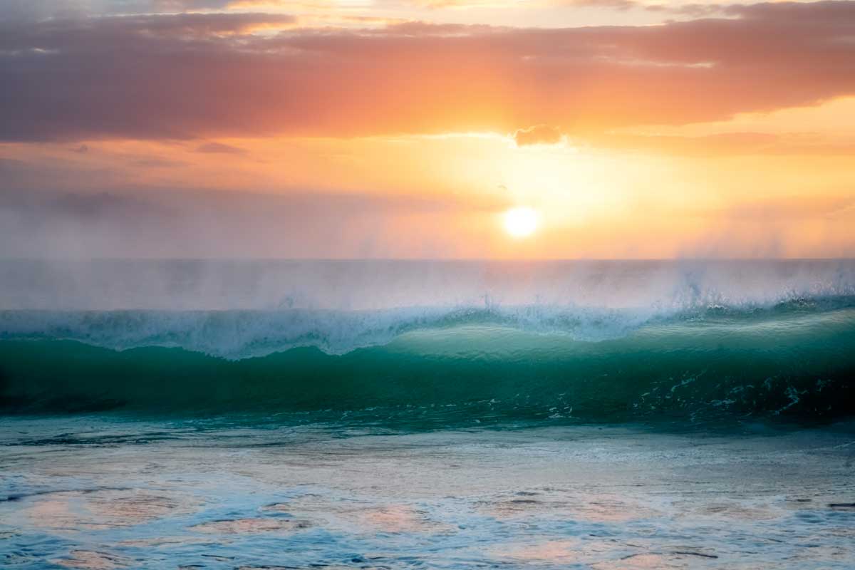 Sunset and Waves by artist  Dennis Frates